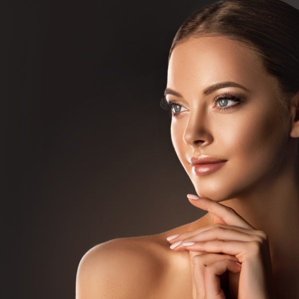 Women in full natural make up with tired back hair