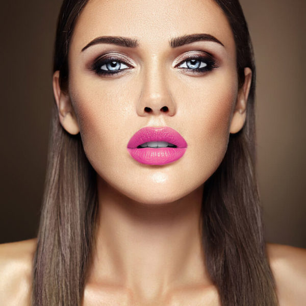 woman with pink lips looking at camera